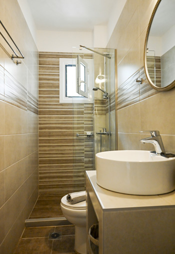 Modern looking bathroom with shower Gina studios - Benitses - renovated bathrooms
